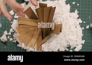 Creative hobby at home. Woman making decorative aroma candle. wooden wicks into jar. Concept of making candles.