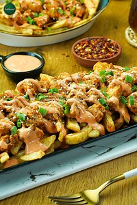 66K views · 945 reactions |  Our Dynamite Loaded Fries are smothered in a fiery sauce, loaded with cheese, and packed with flavor. Order yours now and feel the heat! #fries #loadedfries #snacks | SuperChef | Facebook