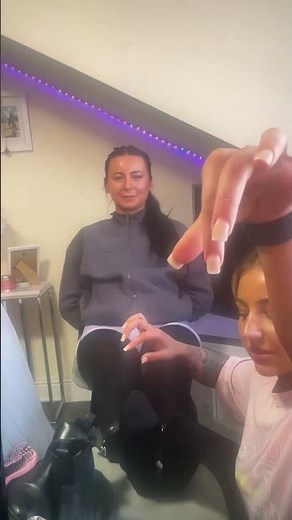 Girl gets tickled on the feet with long white nails