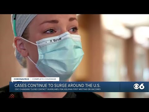 COVID-19 cases surge across US; CDC revises 'close contact' guidelines