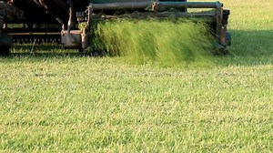 Mowing grass in a football stadium
