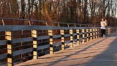 Young woman jogging on bridge