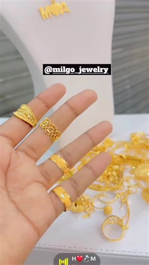 Intricate Gold Jewelry Showcase with Decorative Rings