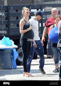Pregnant Behati Prinsloo visits husband Adam Levine on the set of his new music video in downtown Los Angeles. Actor Vince Vaughn is also seen on the set wearing a pokemon costume for a cameo in the scene.  Featuring: Behati Prinsloo Where: Los Angeles, C Stock Photo - Alamy