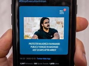 Iran executes man in public hanging from crane amid protests