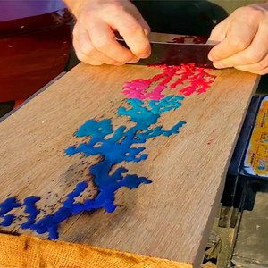 Filling lichtenberg figures on wood with melted crayons. Credit: Tye | Fluid Art Studios