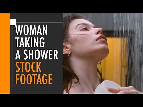 Beautiful woman taking a shower | Free stock footage
