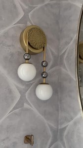 A pair of our Beverly Sconces hang in perfect harmony in a powder room by @widellboschetti. #ArteriorsHome #DesignInspo #Sconces | Arteriors Home