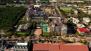 Flying away and panning up view of The Henderson beach resort and spa in Destin FL.