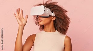 Footage of young Latina woman using VR headset with hand extended on peach cream gradient background