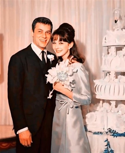 "Tony Curtis and his second wife, Christine Kaufmann, are photographed together on their wedding day in Las Vegas, 1963. The ceremony took place at the Riviera Hotel, just months after the couple met while filming Taras Bulba in 1962. Curtis, already a Hollywood icon, was 38 at the time, while Kaufmann—an acclaimed German actress—was only 18, making headlines with their May-December romance. Despite the age gap, the union drew widespread public attention and media fascination. The pair settled b