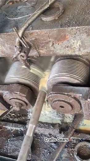 The process of applying threads to a steel rod on a machine