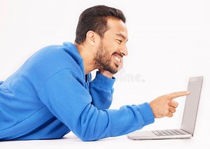 Smile, Laptop and Man Pointing on Studio Floor Isolated on a White Background. Computer, Happy or Person on Ground for Stock Photo - Image of streaming, smiling: 285227342