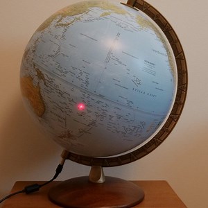 Earth globe laser tracker