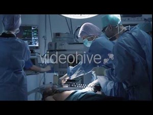 Medical Team Performing Defibrillation in Modern Operating Room - Stock | VideoHive 15024815