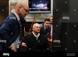 Defense attorney Corey Chirafisi, left, Judge Bruce Schroeder and Kyle Rittenhouse look at video screen as attorneys for both sides argue about a video during Kyle Rittenhouse's trial at the Kenosha County Courthouse in Kenosha, Wis., on Friday, Nov. 12, 2021. Rittenhouse is accused of killing two people and wounding a third during a protest over police brutality in Kenosha, last year. (Mark Hertzberg /Pool Photo via AP Stock Photo - Alamy