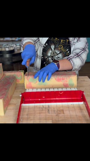 Cutting into my Cranberry Jingle soap today! 🍒🛁 It came out a tad darker than planned (first batch was lighter, but hey, that’s the magic of handmade soap—every one’s unique! ✨) Bursting with cranberry citrus vibes, it’s holiday perfection. Who’s ready for festive showers? 🎄 #HandmadeSoap #SoapCutting #CranberrySoap #HolidayVibes #SoapMaking | Happy Heifer Soap & Gifts