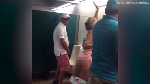 Drunk woman pees in men's urinals at Miami Dolphins game