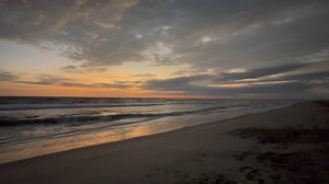 Good Morning from OBX Sunrise Oregon Inlet ramp 4 63 feels like 54 NNE at 18 mph light showers passing thru this morning | OBX Sunrise