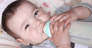 clip-3796069501-baby-drinking-formula-bottle