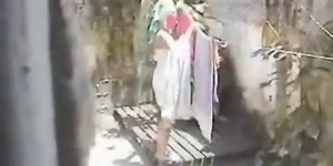 Spying neighbor naked in the backyard