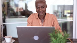 Mature black woman working with computer laptop at bar terrace - Beautiful elderly african person enjoy technology Stock Video