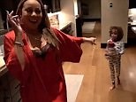 Mariah Carey dances around kitchen to her own music with son