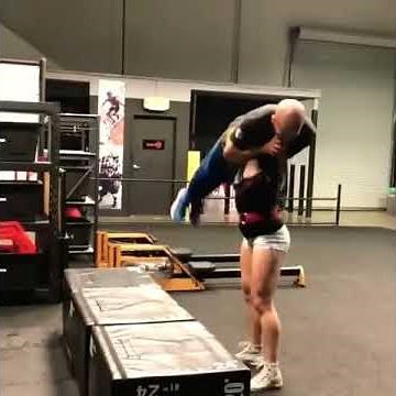 Girl lifts a guy overhead 2
