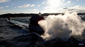 Waves batter Grand Haven lighthouse as gale warning issued for Lake Michigan