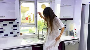 Pretty girl washing a window in a see-through dress | Nude Video on YouTube