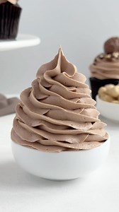 Enjoy the swirl. Find the recipe for my chocolate hazelnut buttercream frosting on cakemehometonight.com. #buttercream #buttercreamfrosting #nutella | Cake Me Home Tonight
