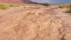 FLASH FLOOD intercepted by Dominator Drone south of Bitter Springs, Arizona today. This is the first of two flash flood front walls intercepted by drone. Note the large barrel that seems to bopping up and down in a stationary wave. Second flood intercept coming David Rankin RadarOmega | Reed Timmer Extreme Meteorologist