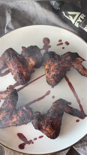 Time to pull out the FYR BLK to haunt up chicken wing night. These bat wings 🦇 were seasoned with baking powder and Over The Fire Cooking by Derek Wolf Big Bad BBQ Ale from Spiceology I let them rest in the fridge overnight. This helps them get crispy. Then, I smoked them on my Recteq at 275F, until they were cooked through. For the full #Halloween effect, I tossed them in the Fyrstarter BLK. #girlscangrill #batwings #halloweenfood #chickenwings #smoked #recteq | Girls Can Grill