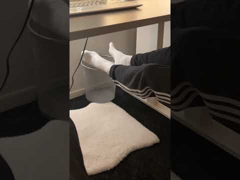 Sockplay in white socks under Table