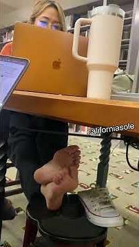Asian girl's candid style feet studying in the library