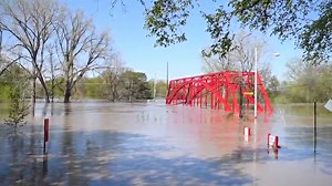 Floodwaters flow from the Tittabawassee River into downtown Midland