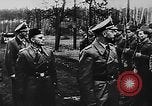 November 21, 1943 – Neuhammer Germany: Head of Schutzstaffe, Heinrich Himmler, inspects Nazi Muslim troops and observes artillery drill in Germany during World War 2