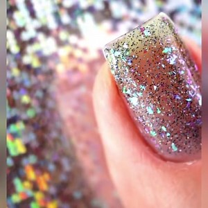 For Lesbian Visabulaty week this is Stormé DeLarverie from our women done wrong collection. With a name like Storme I had to make a storm in a bottle! She has a grey micro holographic glitter base to represent a dark sky with blue and purple shifting iridescent flakes for a little cloud and lightning magic. The Stonewall Rebellion, took place when a lesbian woman by the name of Stormé DeLarverie cause the spark that started a revolution! On that night the police went to a gay bar to ruff up some