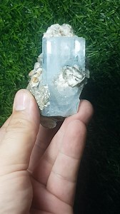 Aesthetic gemmy aquamarine crystal on sharply bladded silver muscovite from nagar valley gilgit baltistan pakistan. The color , luster and clearity is remarkable and can be displayed perfectly. The lower front of aquamarine crystal is etched not damaged .the rest two small aquamarine crysrals are also terminated and perfect . Crystal size 5.5 cm long Price :$265 shipping fee | Artistic minerals