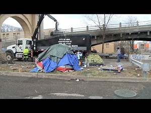 March 2022: Crews work to clean up tent city in Harrisburg, Pa.