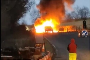 Two cars catch fire after crashing on major Scots road as crews tackle flames