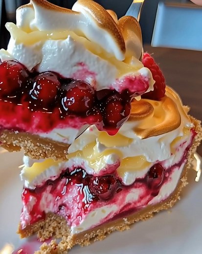 Lemon Raspberry Meringue Cheesecake Tangy, sweet, and beautifully topped with fluffy meringue — this cheesecake is a showstopper! A vibrant mix of lemon and raspberry flavors, perfect for spring, summer, or any special occasion.  #LemonCheesecake #RaspberryDessert #MeringueCheesecake #ElegantDessert #FruitLovers | April Girlss | Facebook