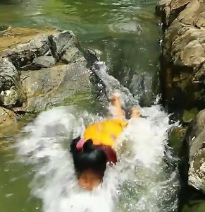 women Swimming catching fish in river for dog | Maria Hadley | Facebook