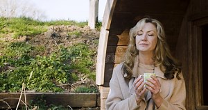 Woman in Her Forties Outside Thoughtful, Sad or Depressed in Golden Winter Sunshine Drinking Mug of Coffee or Cup of Tea Stock Footage - Video of woman, healthy: 296521782