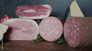 Italian deli meats and cheeses on display in a restaurant. Prosciutto, salami, mortadella, and various cheeses in an Italian deli restaurant.