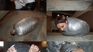 A thick duvet and duct tape mummification cocoon for rara curves (wmv)