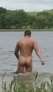 Man removes trunks to swim naked in lake