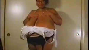 Norma S. unhooks,her bra