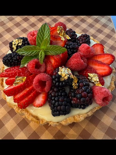 Absolutely stunning quinceanera cake! The cake matched her dress!!!! 🥹🥹🥹🥹 Vanilla with raspberry filling and for the birthday girl, a mini fruit tart! | Dadgum Sweets Bakery