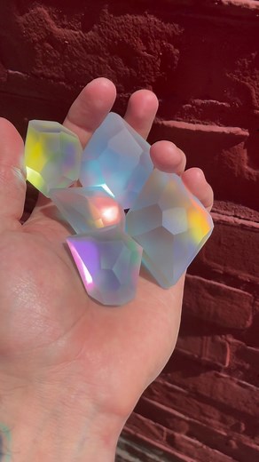 BLOB BLOB STUDIO Wes Heart ❤️ on Instagram: "A handful of micro and mini Lux Captus Crystals. I love the different way they shine in bright light and the shade. . Royal, Starlight, Rose Gold, Fire, and Moon . Hot-sculpted, laminated, and hand-carved glass . BlobBlobStudio.com"